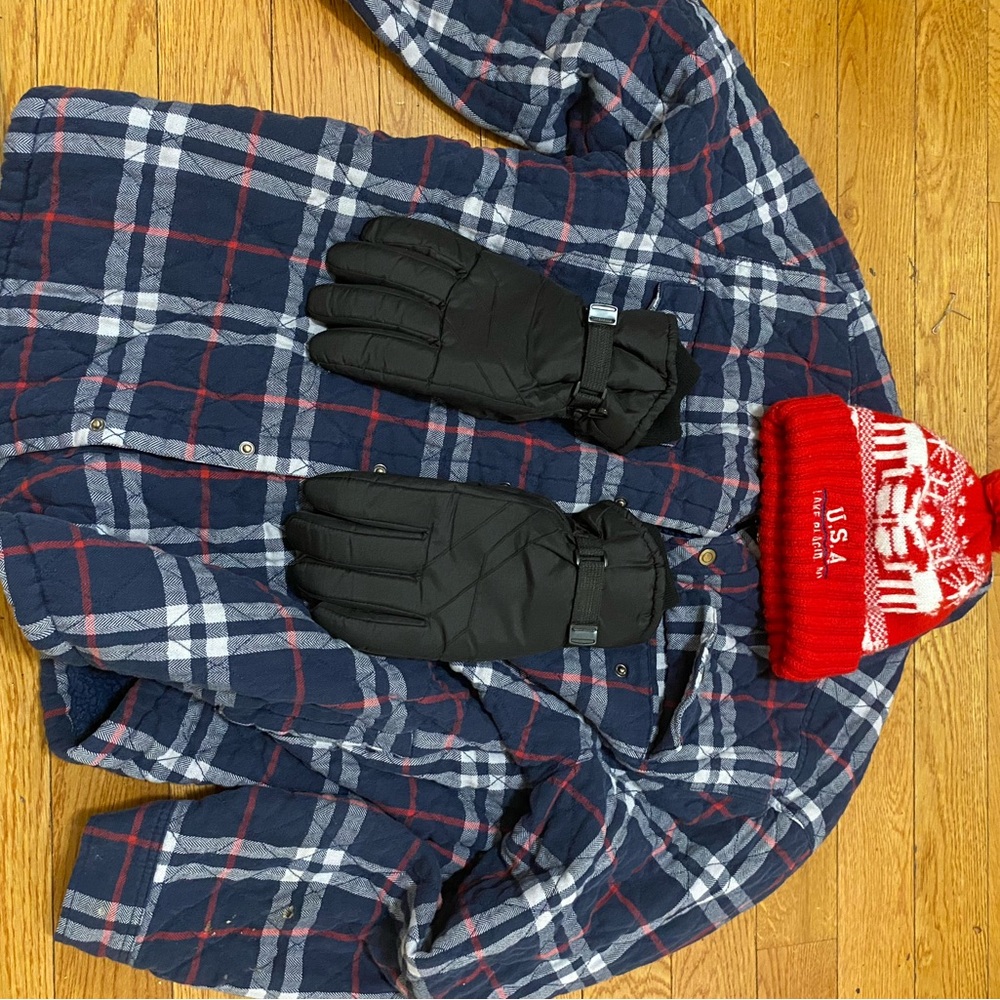 Heavy winter coat with heavy gloves and hat